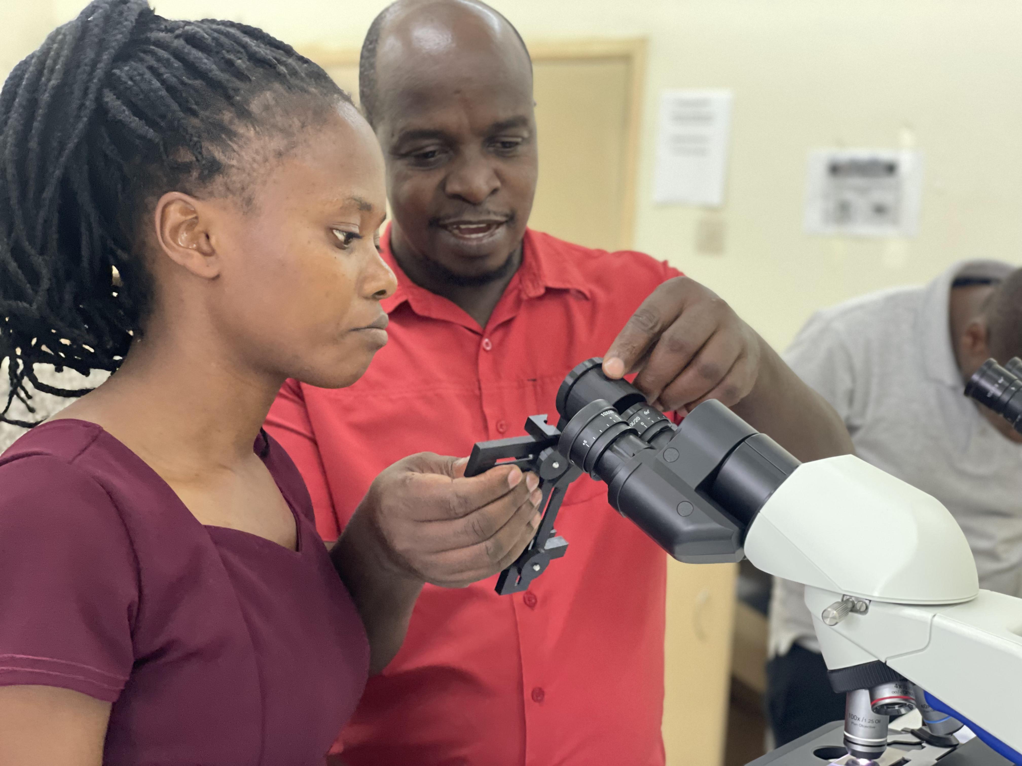 Laboratory professional using microscopy workflow